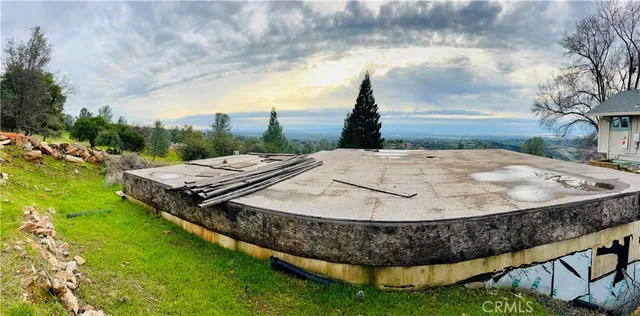 a view of a backyard with sitting area