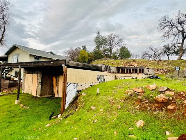 a view of swimming pool with an outdoor seating and a garden