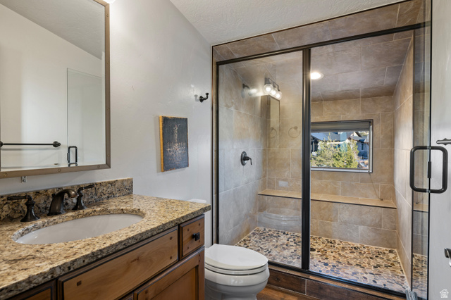 707 Chimney Rock Road, Unit 247 Heber City, UT 84032 - Photo 29 of 64 Full bath featuring vanity and a stall shower