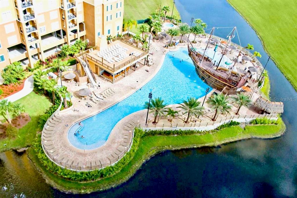 8113 Resort Village Drive, Unit 4405 Orlando, FL 32821 - Photo 2 of 25 an aerial view of a house with a swimming pool