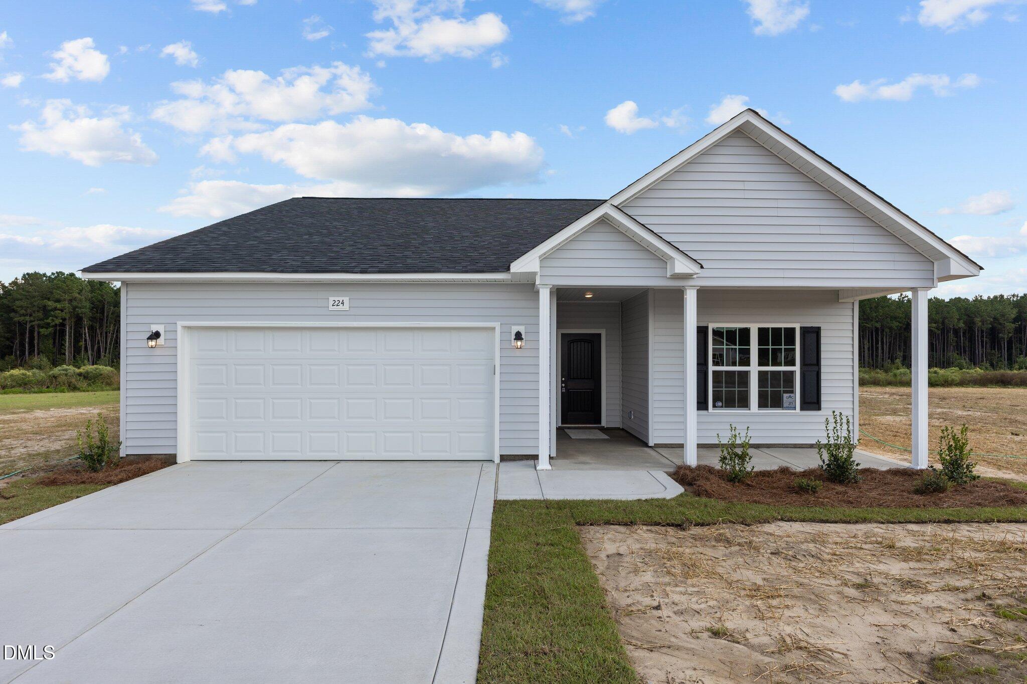 506 Bill Avery Road Coats, NC 27521 - Photo 1 of 21 front view of a house with a yard