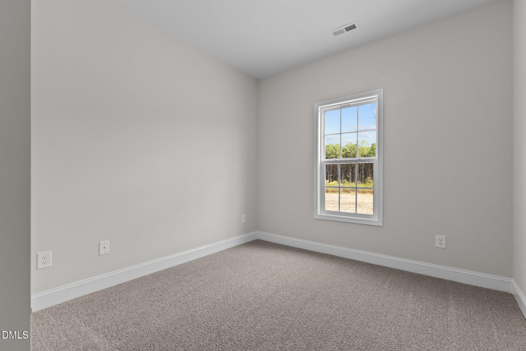 506 Bill Avery Road Coats, NC 27521 - Photo 13 of 21 an empty room with a window