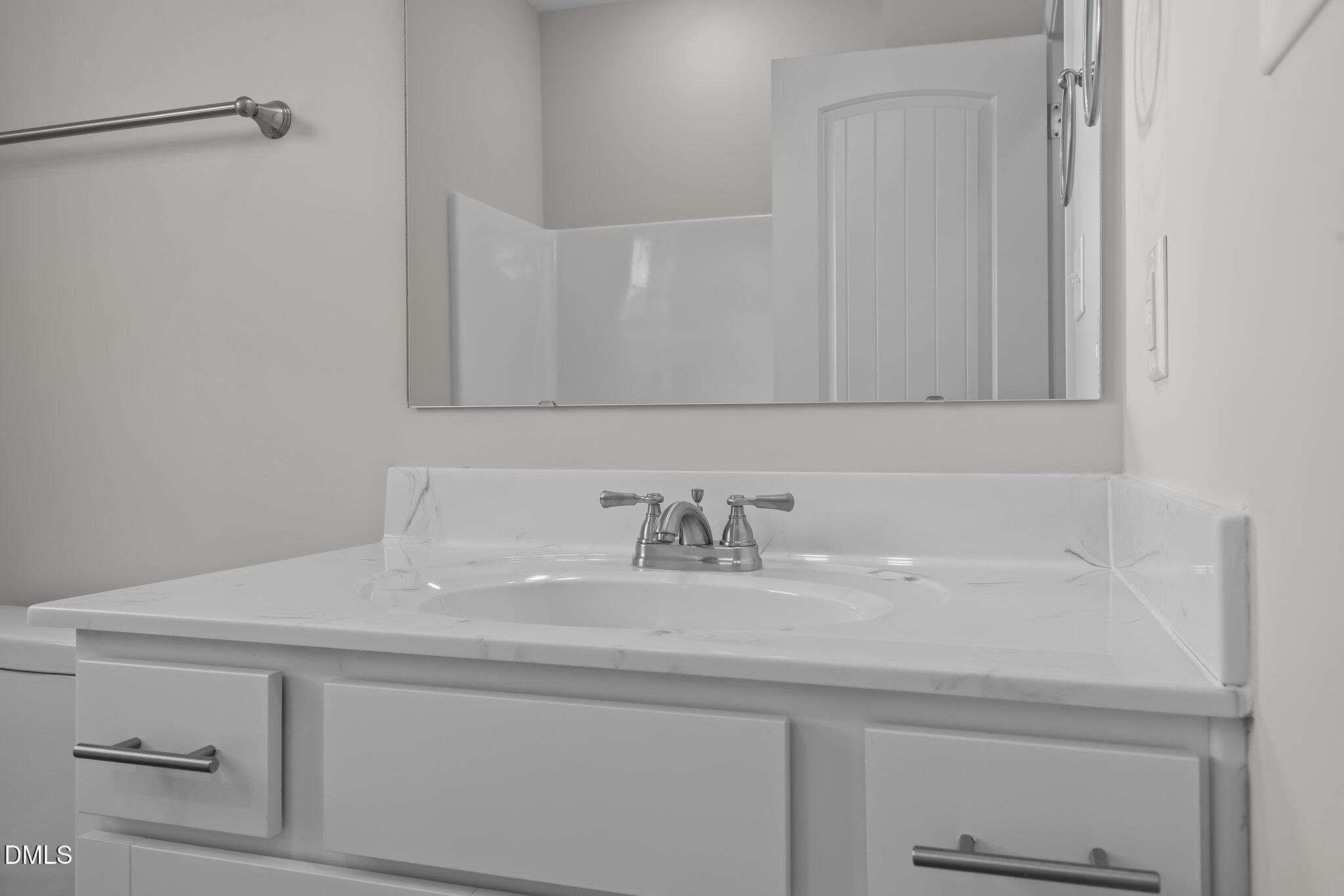 506 Bill Avery Road Coats, NC 27521 - Photo 15 of 21 a bathroom with a sink and a mirror