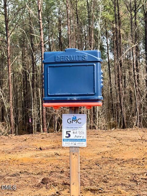 506 Bill Avery Road Coats, NC 27521 - Photo 20 of 21 a sign on the side of a building
