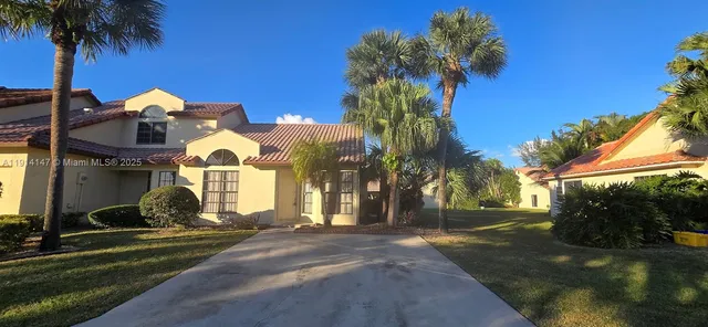 a view of a park with palm trees
