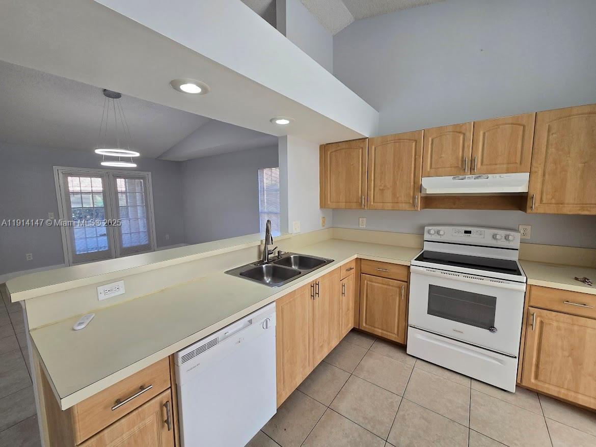 Lakes at Boca Raton Boca Raton, FL 33498 - Photo 2 of 18 a kitchen with a sink and a stove top oven
