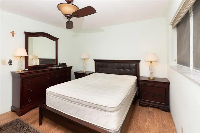 a bedroom with a bed and a dresser