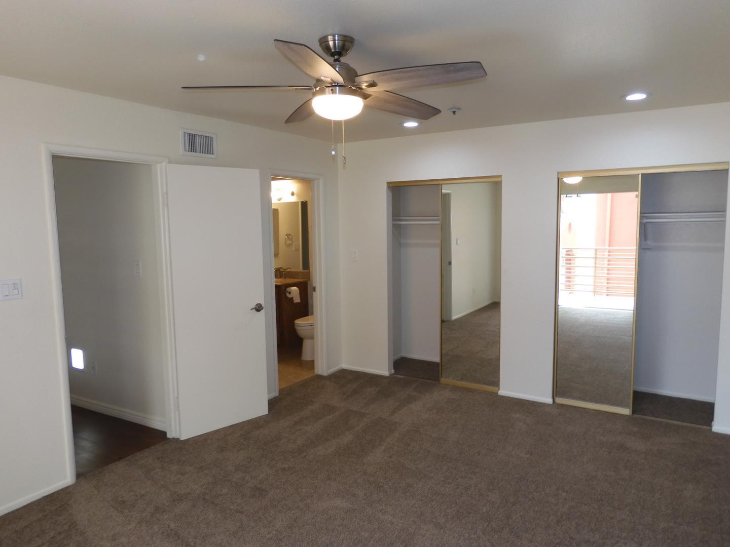 154 West 5th Street, Unit 233 Tempe, AZ 85281 - Photo 20 of 29 an empty room with closet and a ceiling fan