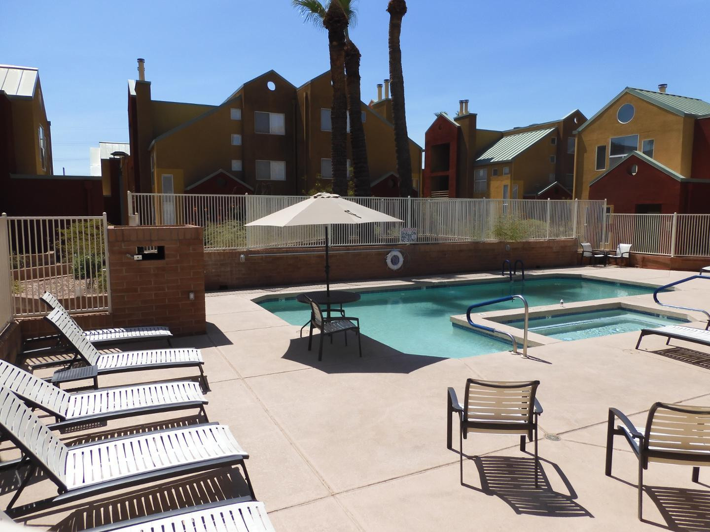 154 West 5th Street, Unit 233 Tempe, AZ 85281 - Photo 26 of 29 a backyard of a house with table and chairs
