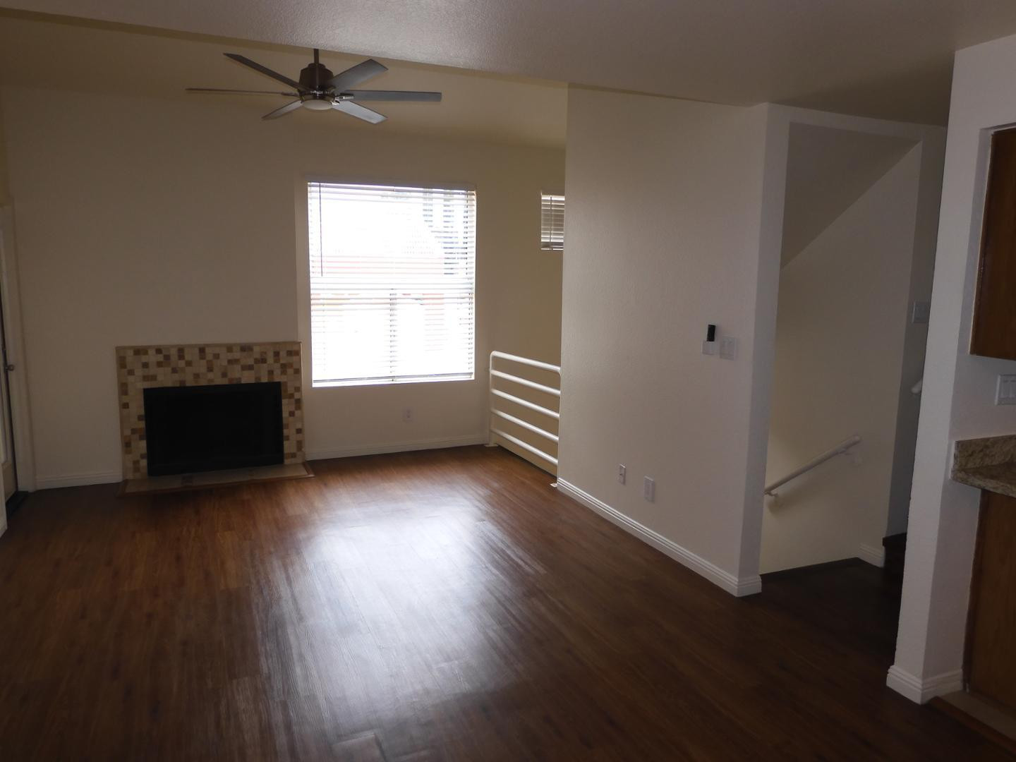 154 West 5th Street, Unit 233 Tempe, AZ 85281 - Photo 3 of 29 an empty room with wooden floor fireplace and windows