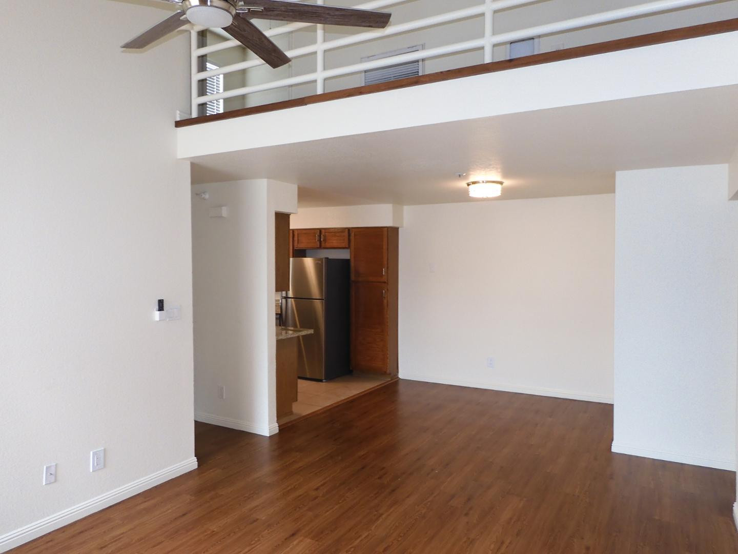 154 West 5th Street, Unit 233 Tempe, AZ 85281 - Photo 4 of 29 a view of a hallway with wooden floor