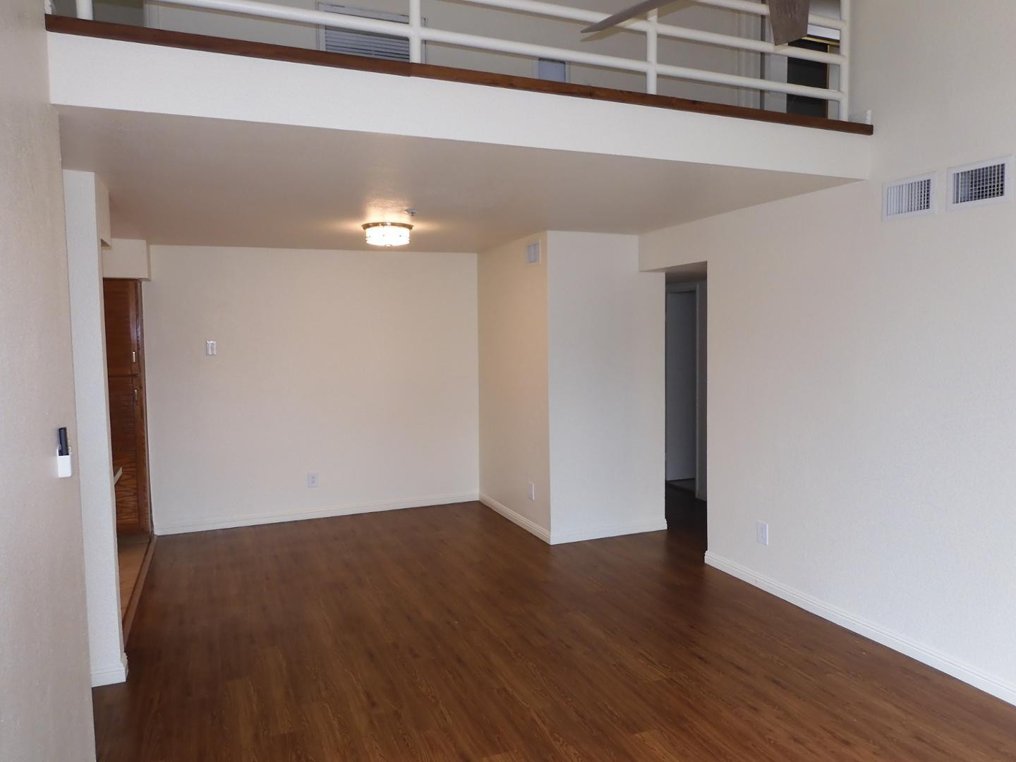 154 West 5th Street, Unit 233 Tempe, AZ 85281 - Photo 5 of 29 a view of an empty room with wooden floor