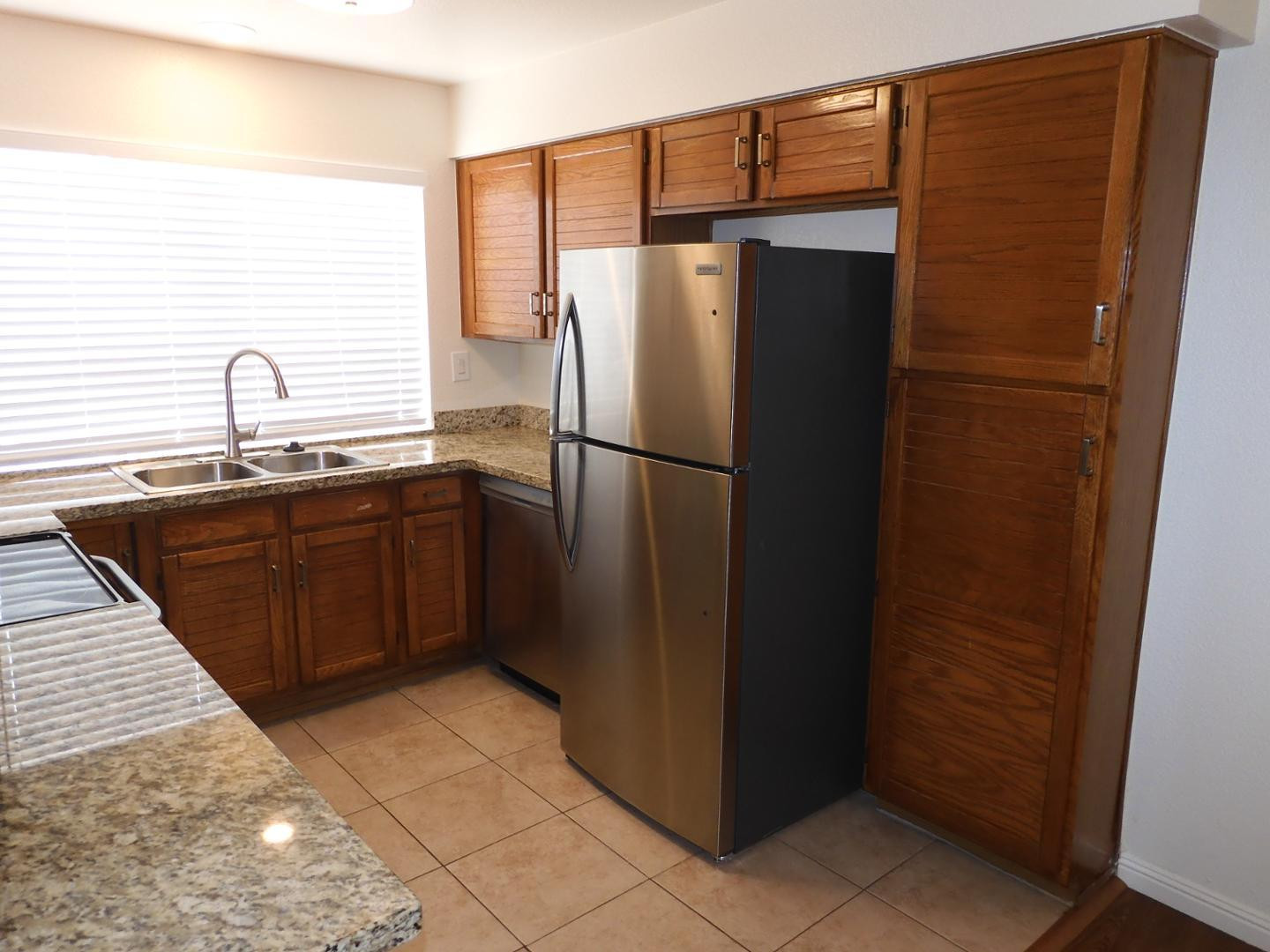 154 West 5th Street, Unit 233 Tempe, AZ 85281 - Photo 7 of 29 a white refrigerator freezer sitting inside of a kitchen