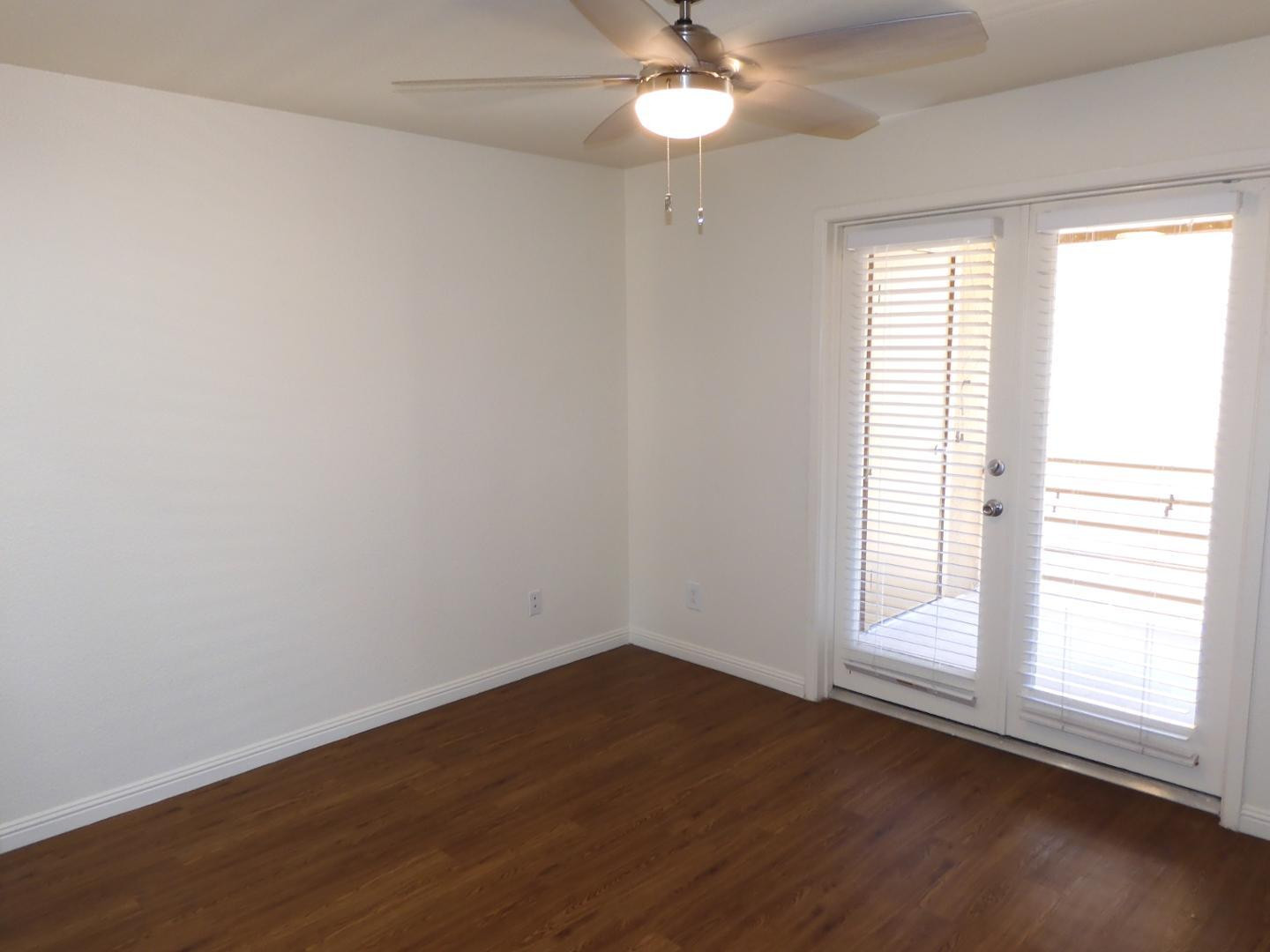 154 West 5th Street, Unit 233 Tempe, AZ 85281 - Photo 10 of 29 an empty room with wooden floor and windows