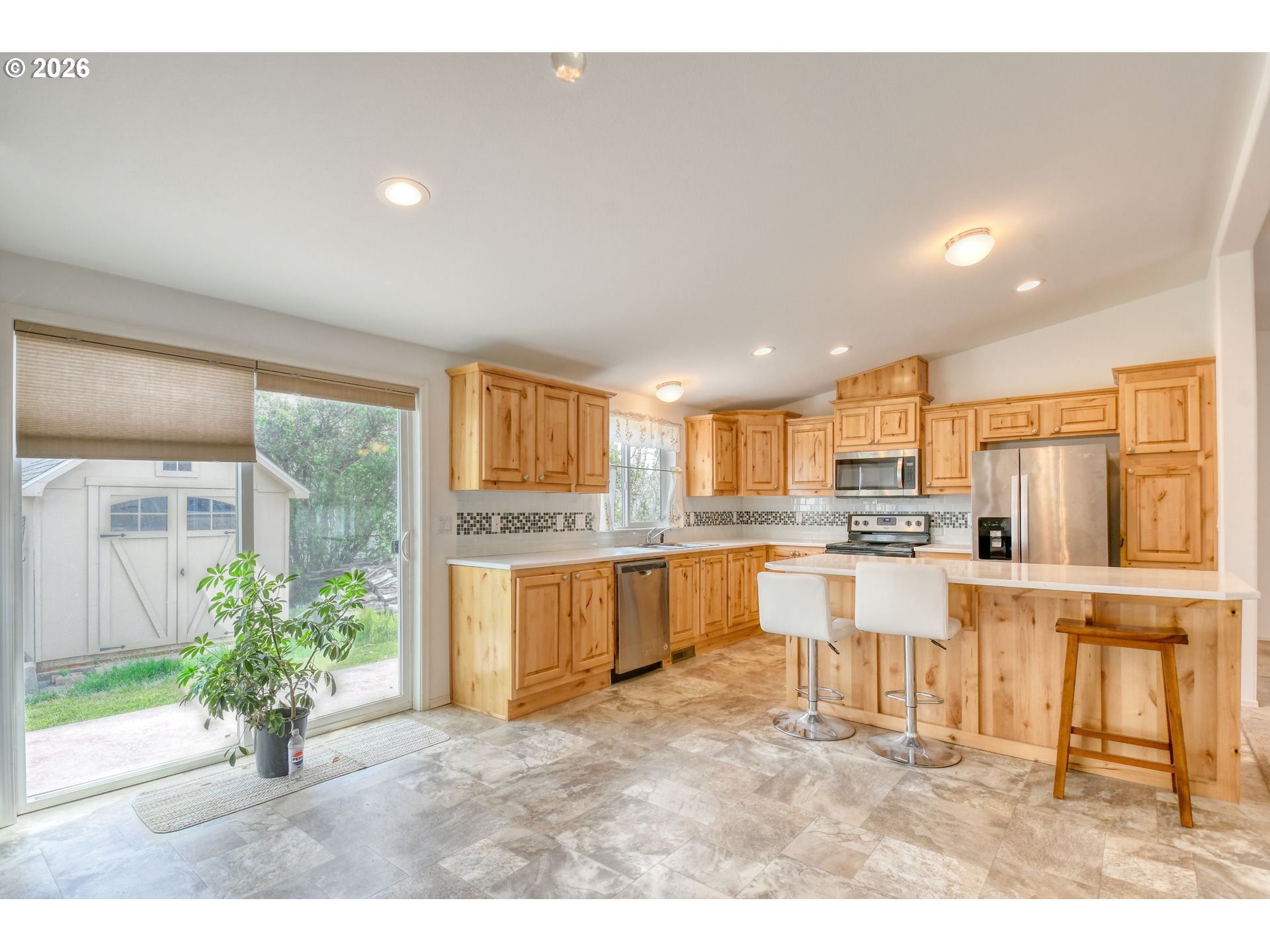 303 East College Street Athena, OR 97813 - Photo 11 of 42 a kitchen with white cabinets and counter space