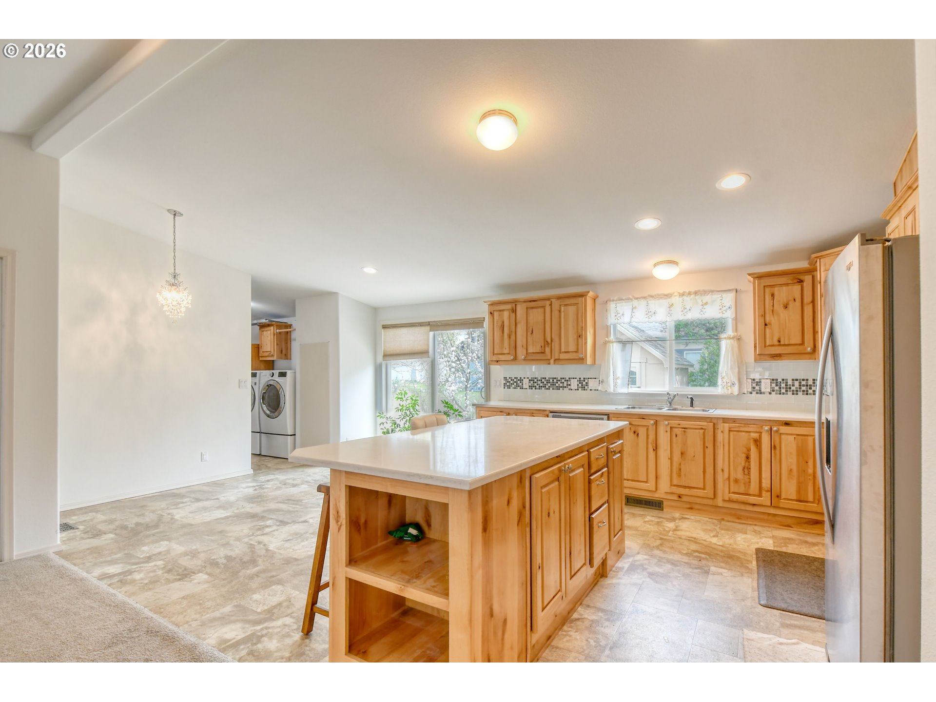 303 East College Street Athena, OR 97813 - Photo 13 of 42 a kitchen with stainless steel appliances granite countertop a sink and a refrigerator