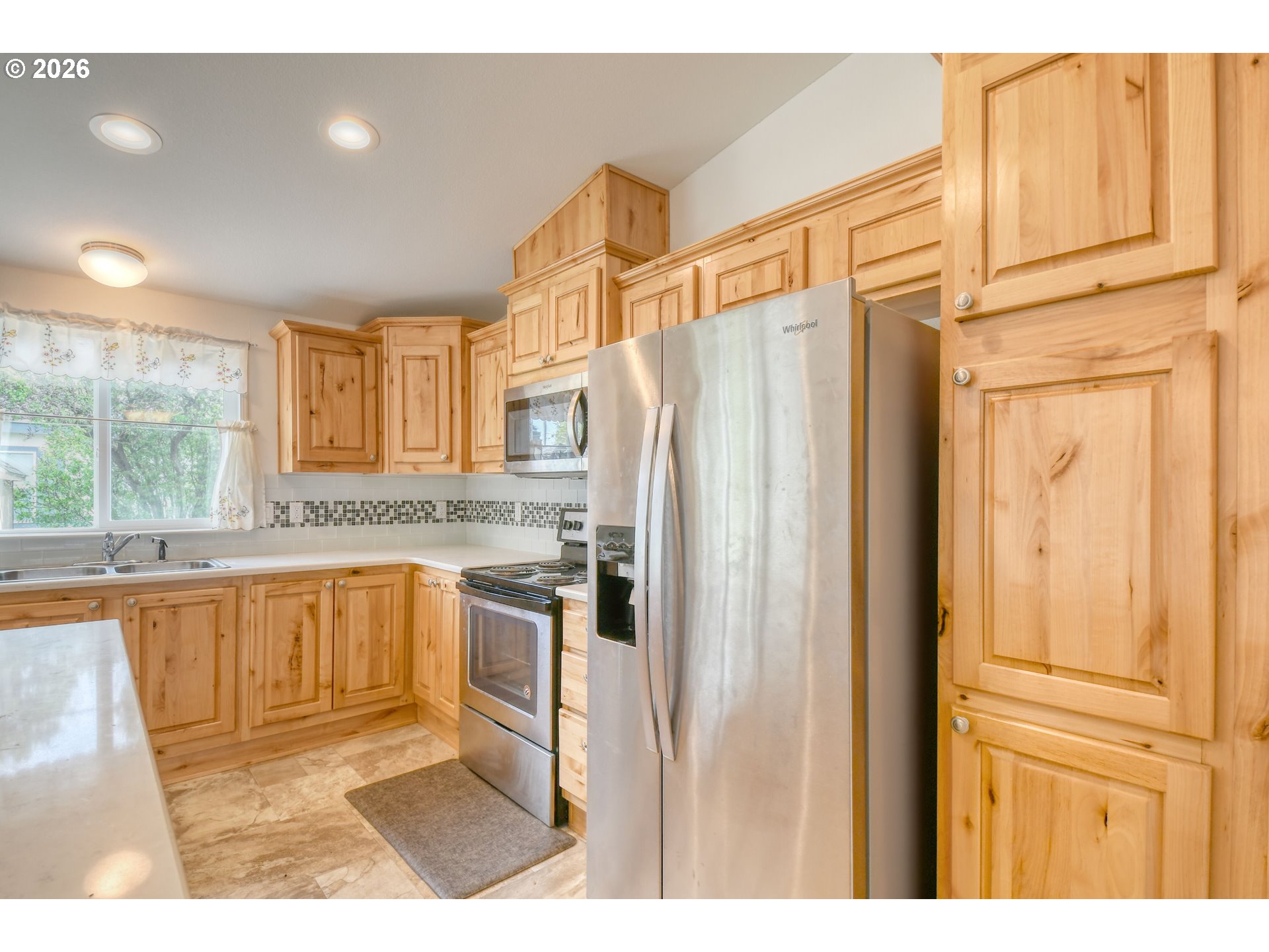 303 East College Street Athena, OR 97813 - Photo 17 of 42 a kitchen with stainless steel appliances granite countertop a refrigerator and a sink