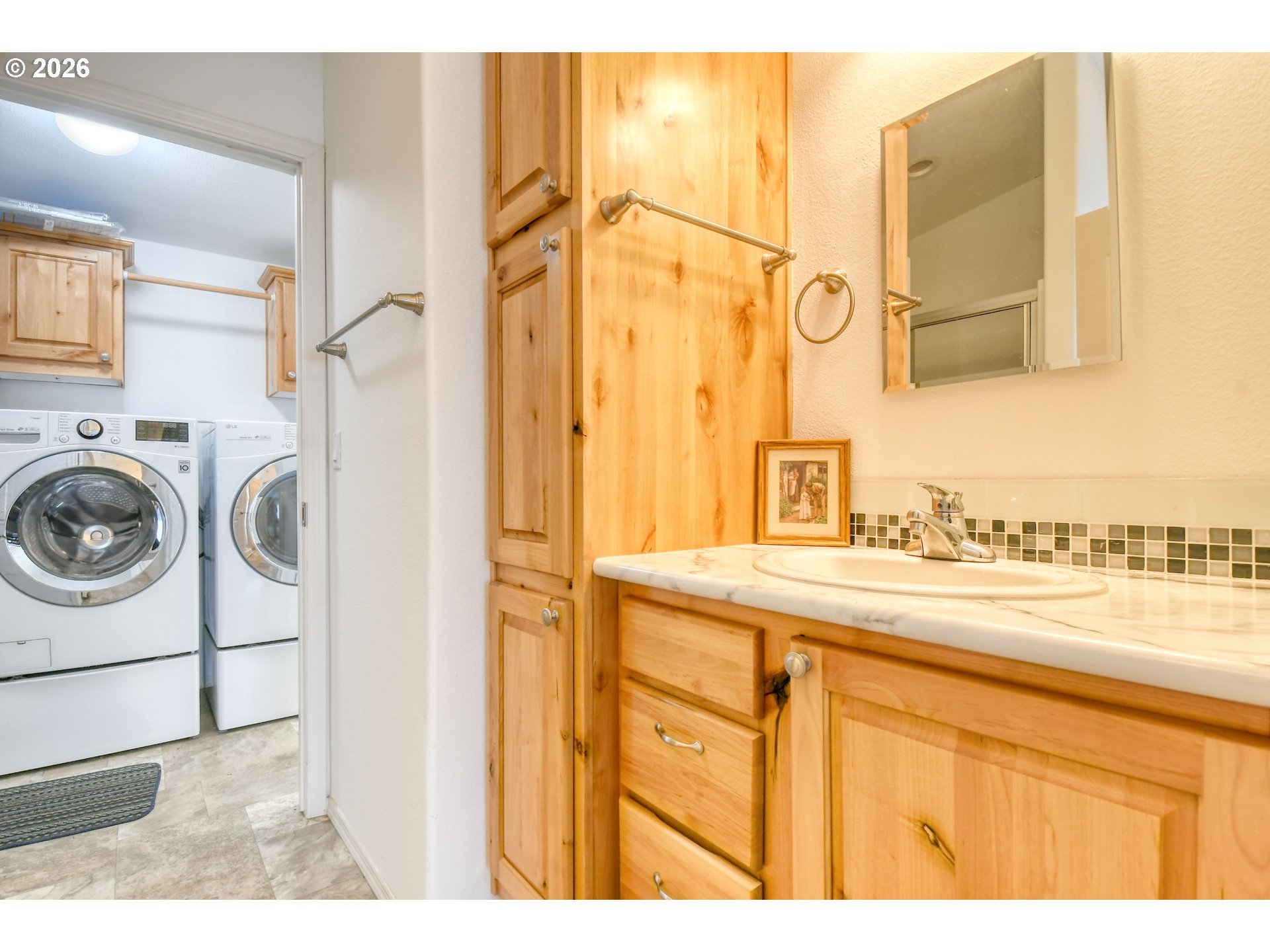 303 East College Street Athena, OR 97813 - Photo 24 of 42 a bathroom with a sink and a washing machine with the view of bathroom