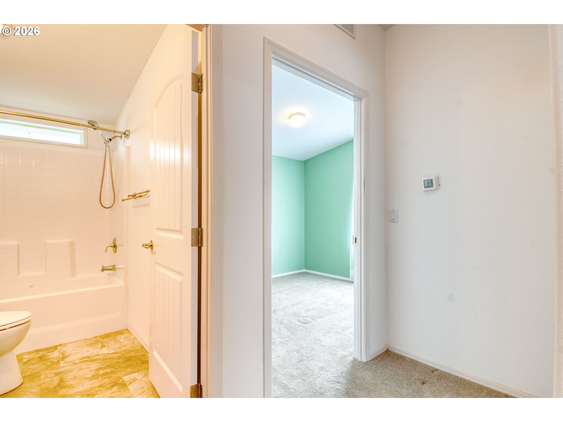 303 East College Street Athena, OR 97813 - Photo 27 of 42 a bathroom with a glass shower door
