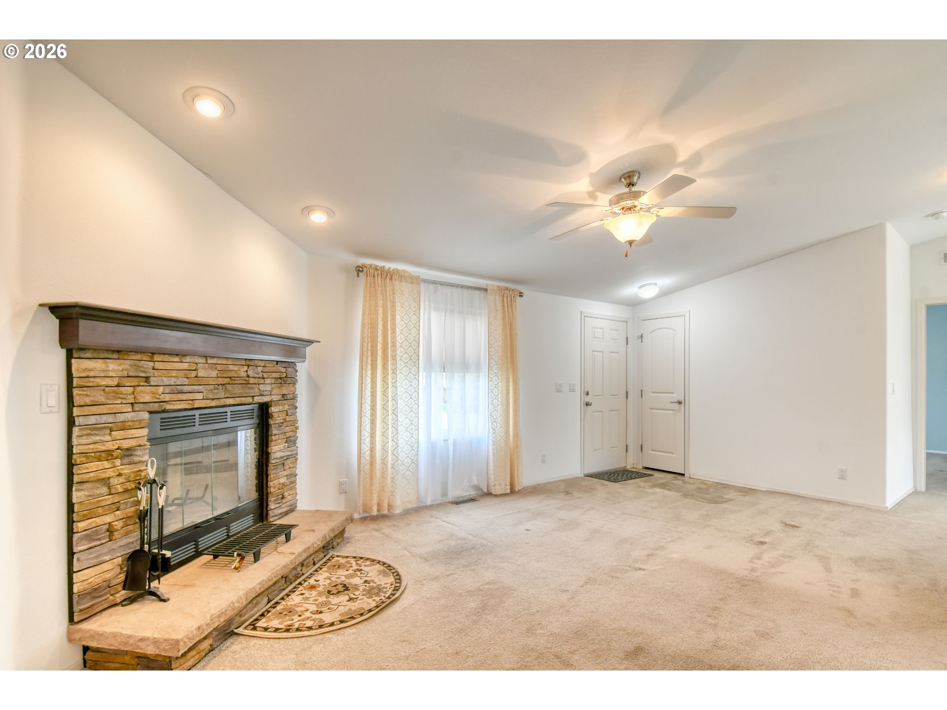 303 East College Street Athena, OR 97813 - Photo 4 of 42 a view of an empty room with a fireplace