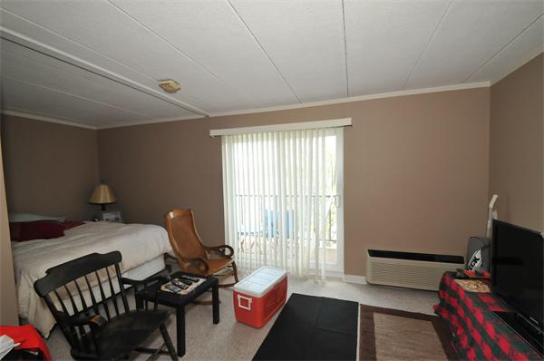 40 Cochituate Road, Unit 39 Framingham, MA 01701 - Photo 4 of 16 a bedroom with furniture and a window
