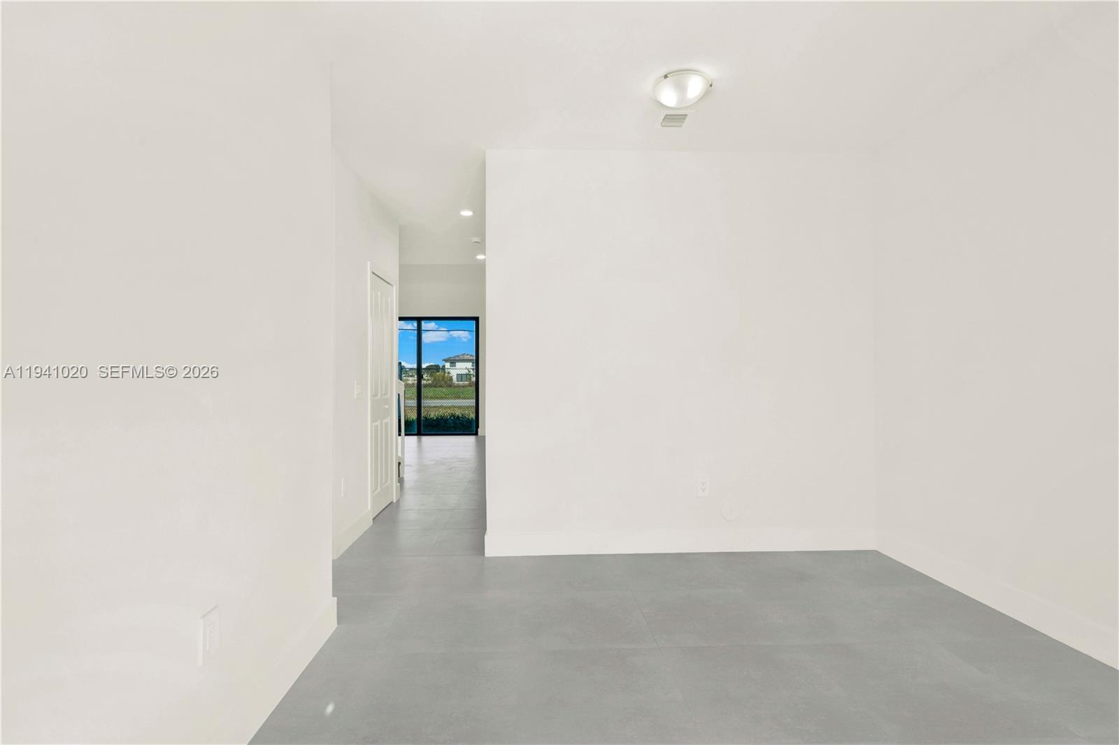 18981 Southwest 344th Terrace, Unit 18981 Homestead, FL 33034 - Photo 11 of 34 a view of an empty room