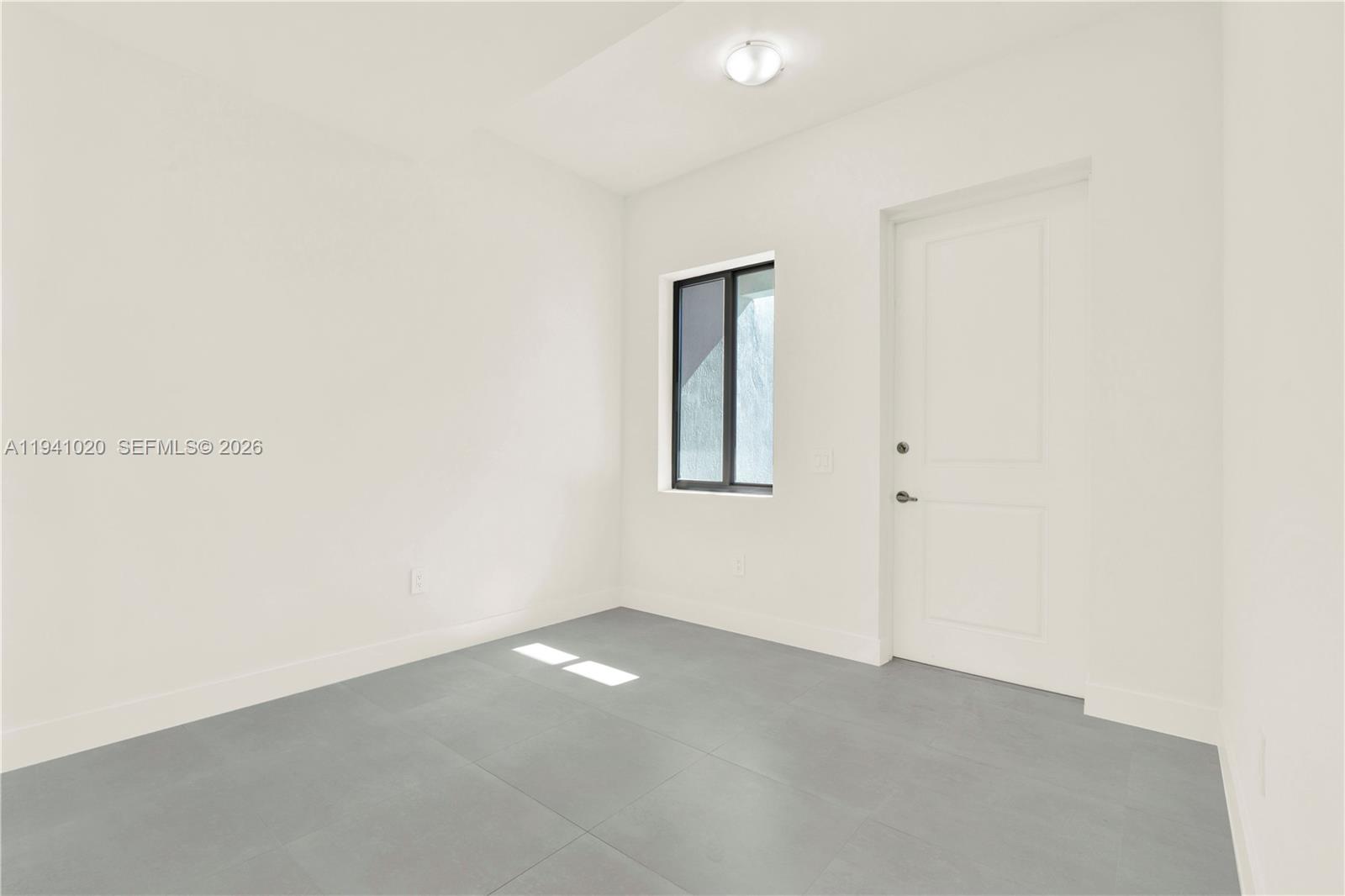 18981 Southwest 344th Terrace, Unit 18981 Homestead, FL 33034 - Photo 13 of 34 a view of an empty room