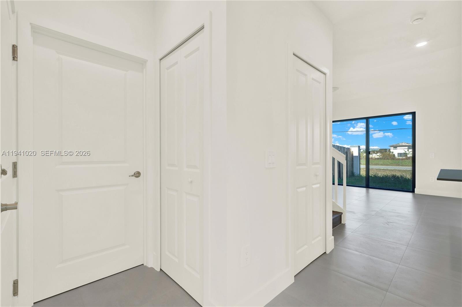 18981 Southwest 344th Terrace, Unit 18981 Homestead, FL 33034 - Photo 14 of 34 a view of a hallway with wooden floor