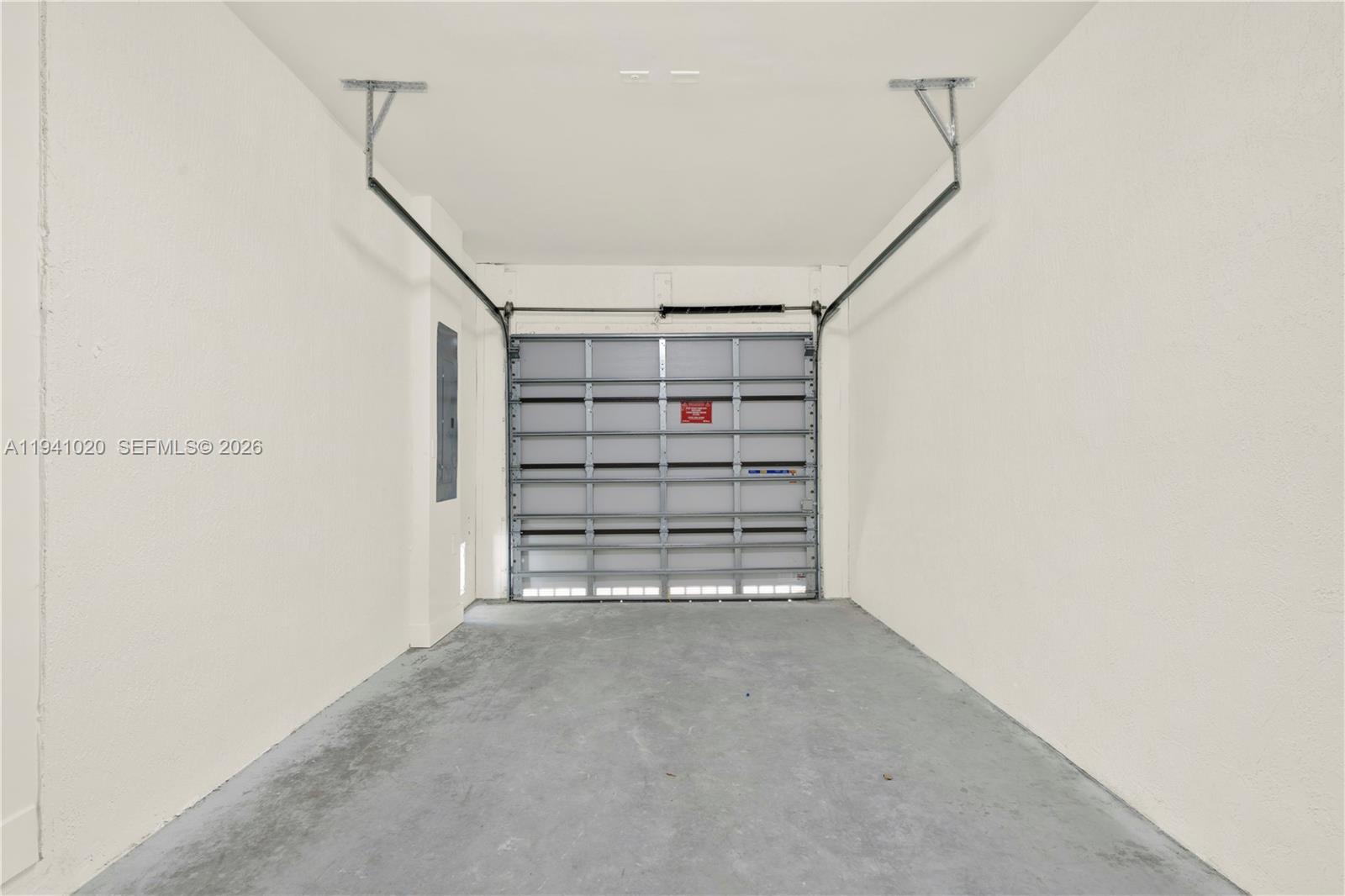 18981 Southwest 344th Terrace, Unit 18981 Homestead, FL 33034 - Photo 16 of 34 a view of room with racks on the wall