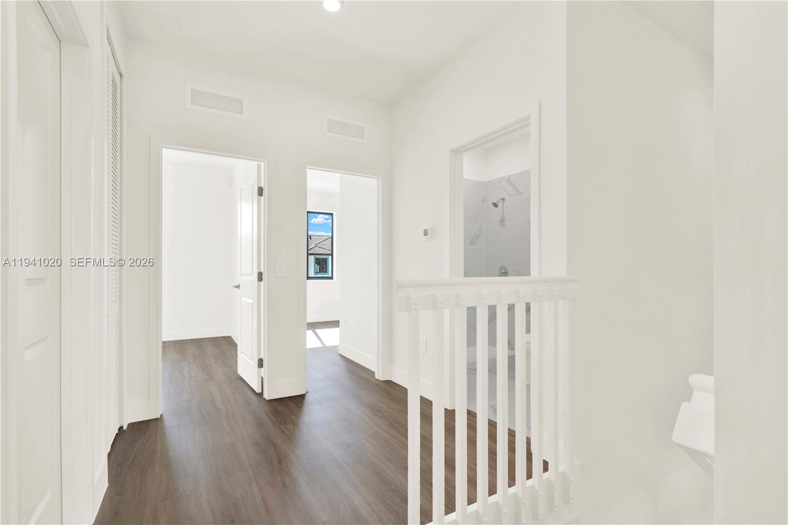 18981 Southwest 344th Terrace, Unit 18981 Homestead, FL 33034 - Photo 19 of 34 a view of hallway with wooden floor