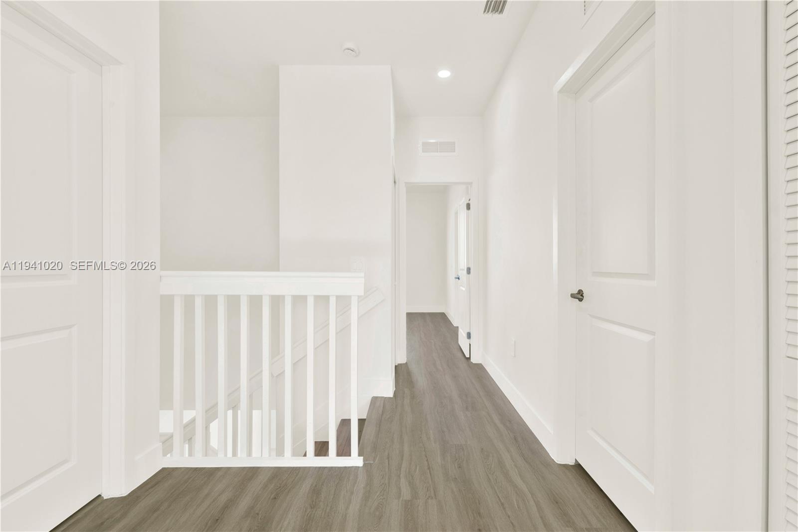 18981 Southwest 344th Terrace, Unit 18981 Homestead, FL 33034 - Photo 31 of 34 a view of a hallway with wooden floor