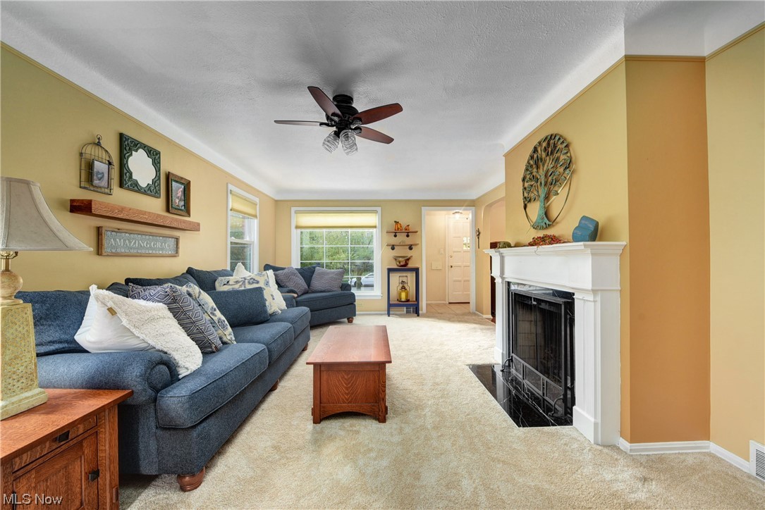 19646 Henry Road Fairview Park, OH 44126 - Photo 4 of 35 Living room with ceiling fan, light carpet.