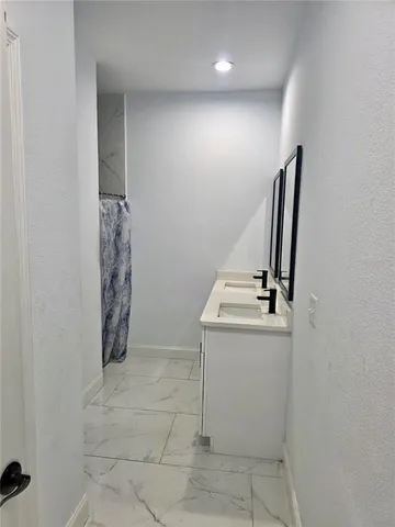 a view of storage and utility room with washer and dryer