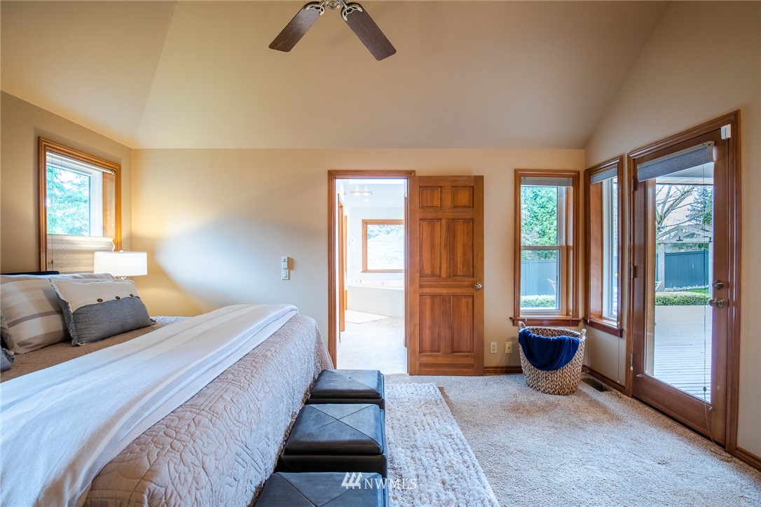2707 187th Street Southeast Bothell, WA 98012 - Photo 14 of 39 a bedroom with a bed and glass door