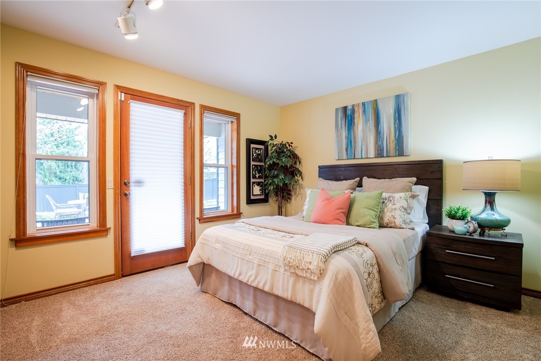 2707 187th Street Southeast Bothell, WA 98012 - Photo 22 of 39 a bedroom with a bed and wooden floor