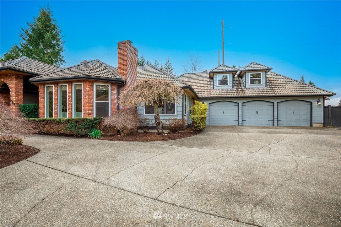 2707 187th Street Southeast Bothell, WA 98012 - Photo 38 of 39 a front view of a house with a yard