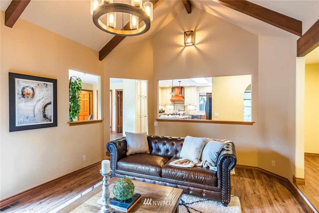 2707 187th Street Southeast Bothell, WA 98012 - Photo 5 of 39 a living room with furniture and a large window