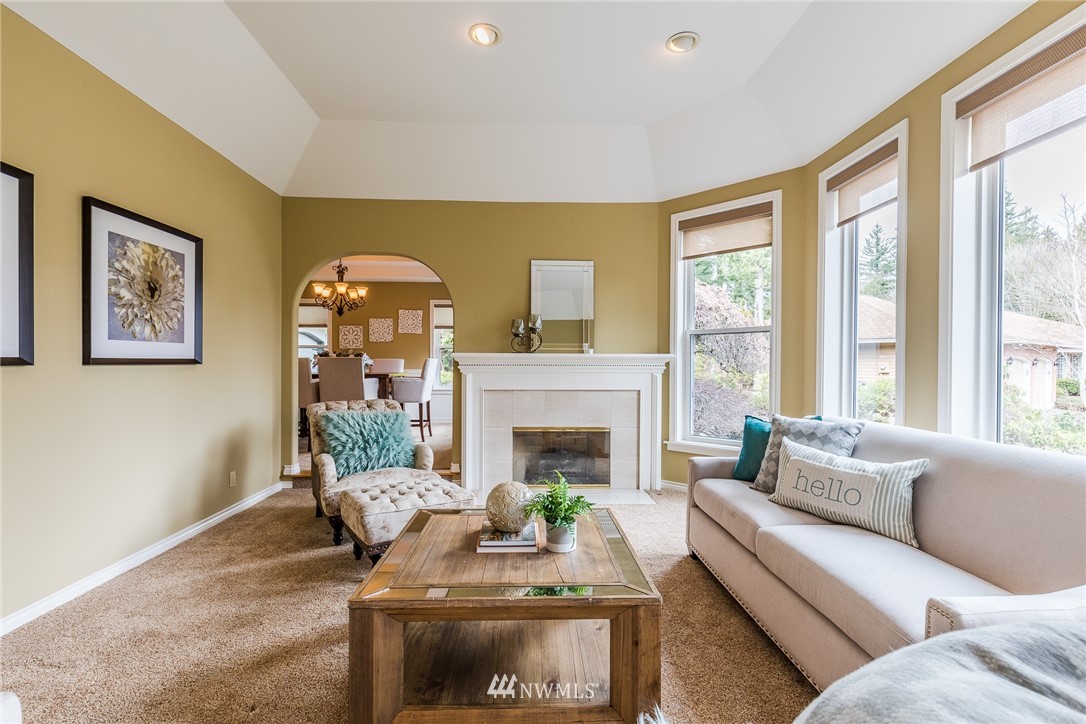 2707 187th Street Southeast Bothell, WA 98012 - Photo 9 of 39 a living room with furniture and a fireplace