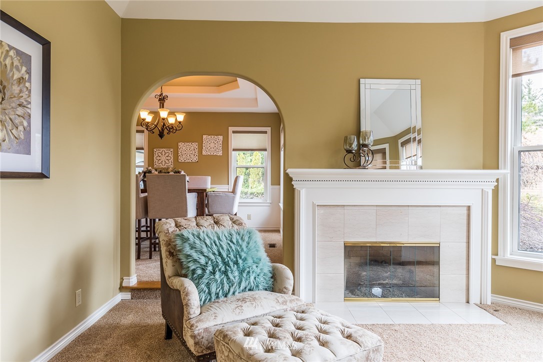 2707 187th Street Southeast Bothell, WA 98012 - Photo 10 of 39 a living room with furniture and a fireplace