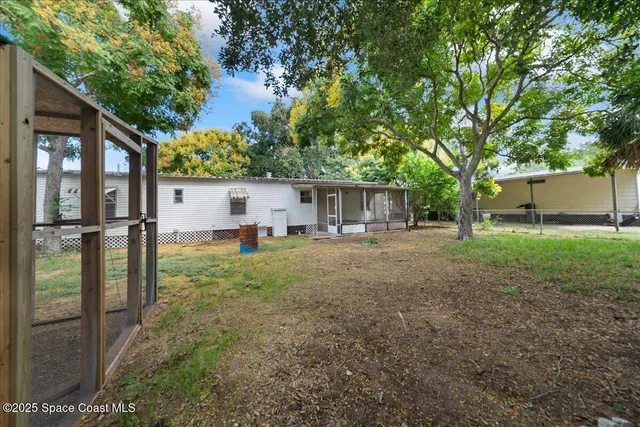 a backyard of a house with seating space