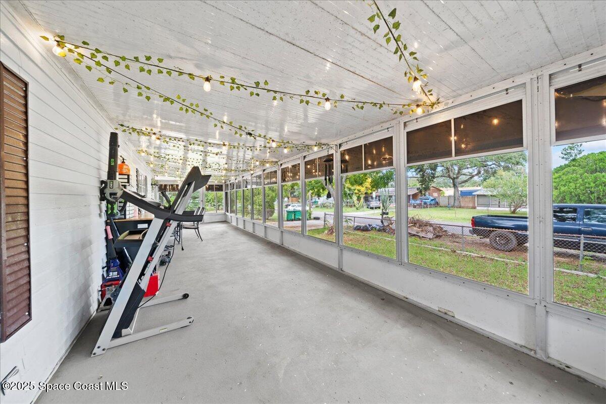 6983 Chestnut Drive Cocoa, FL 32927 - Photo 5 of 28 a view of a room with gym equipment