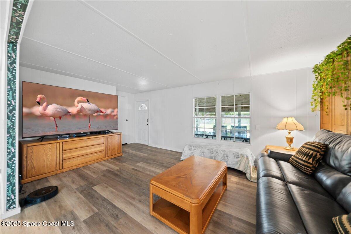 6983 Chestnut Drive Cocoa, FL 32927 - Photo 7 of 28 a living room with furniture and a flat screen tv