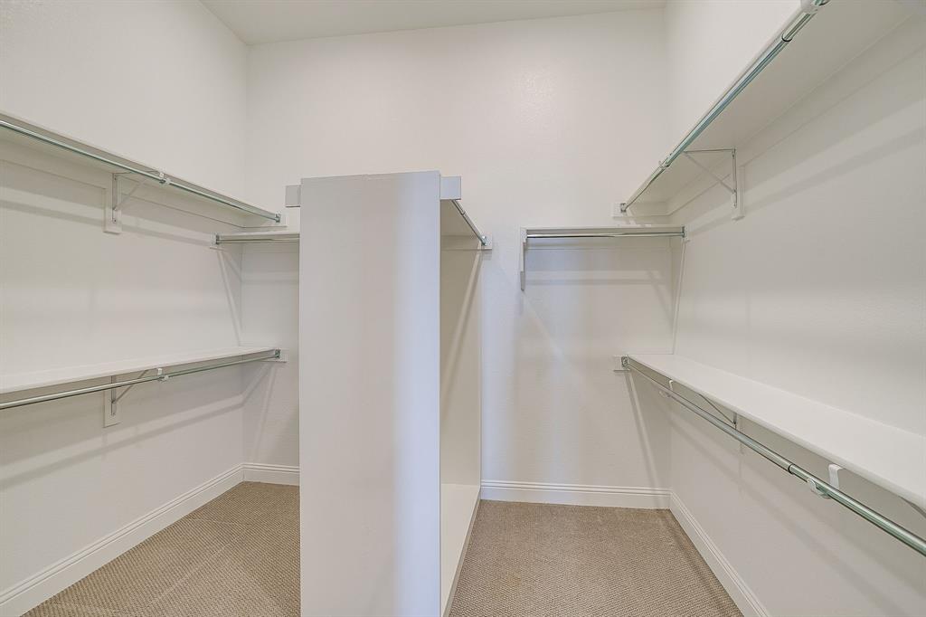 14328 Capridge Road Fort Worth, TX 76008 - Photo 15 of 40 a view of an empty walk in closet