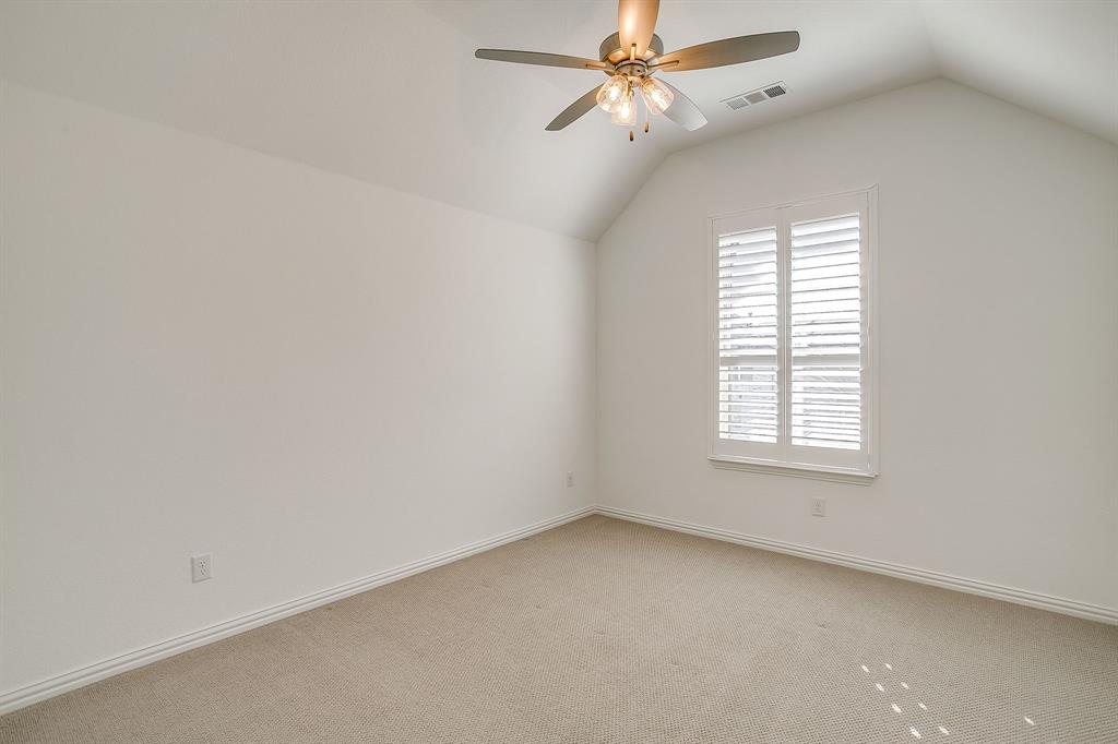 14328 Capridge Road Fort Worth, TX 76008 - Photo 25 of 40 an empty room with a window and a fan