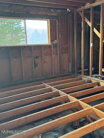 a view of door with wooden floor