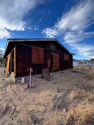 a view of a barn with a sink and a yard