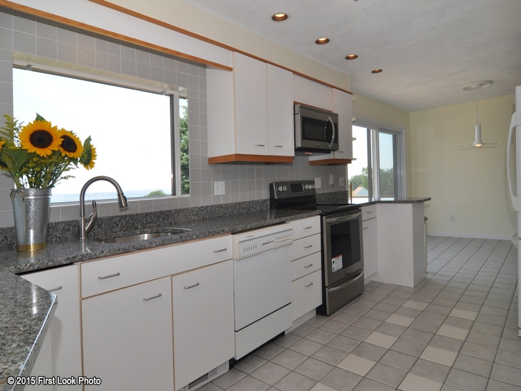 21 Nina Road Portsmouth, RI 02871 - Photo 5 of 30 a kitchen with stainless steel appliances granite countertop a sink and a microwave