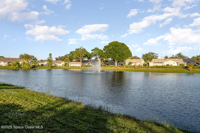 a view of a lake with boats and trees