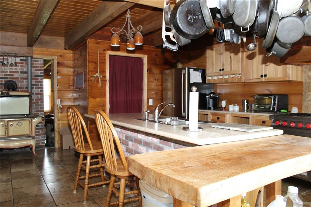 114 Donigan Road Moscow, ME 04920 - Photo 8 of 27 View of kitchen center island with...
