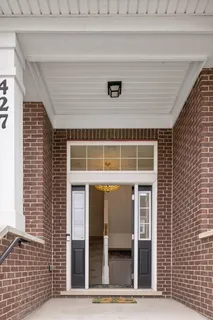 a front view of a house with glass windows